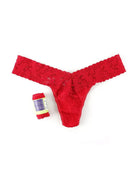 Hanky Panky Low Rise Thong in red lace next to a gift-ready wrap, perfect for special occasions.