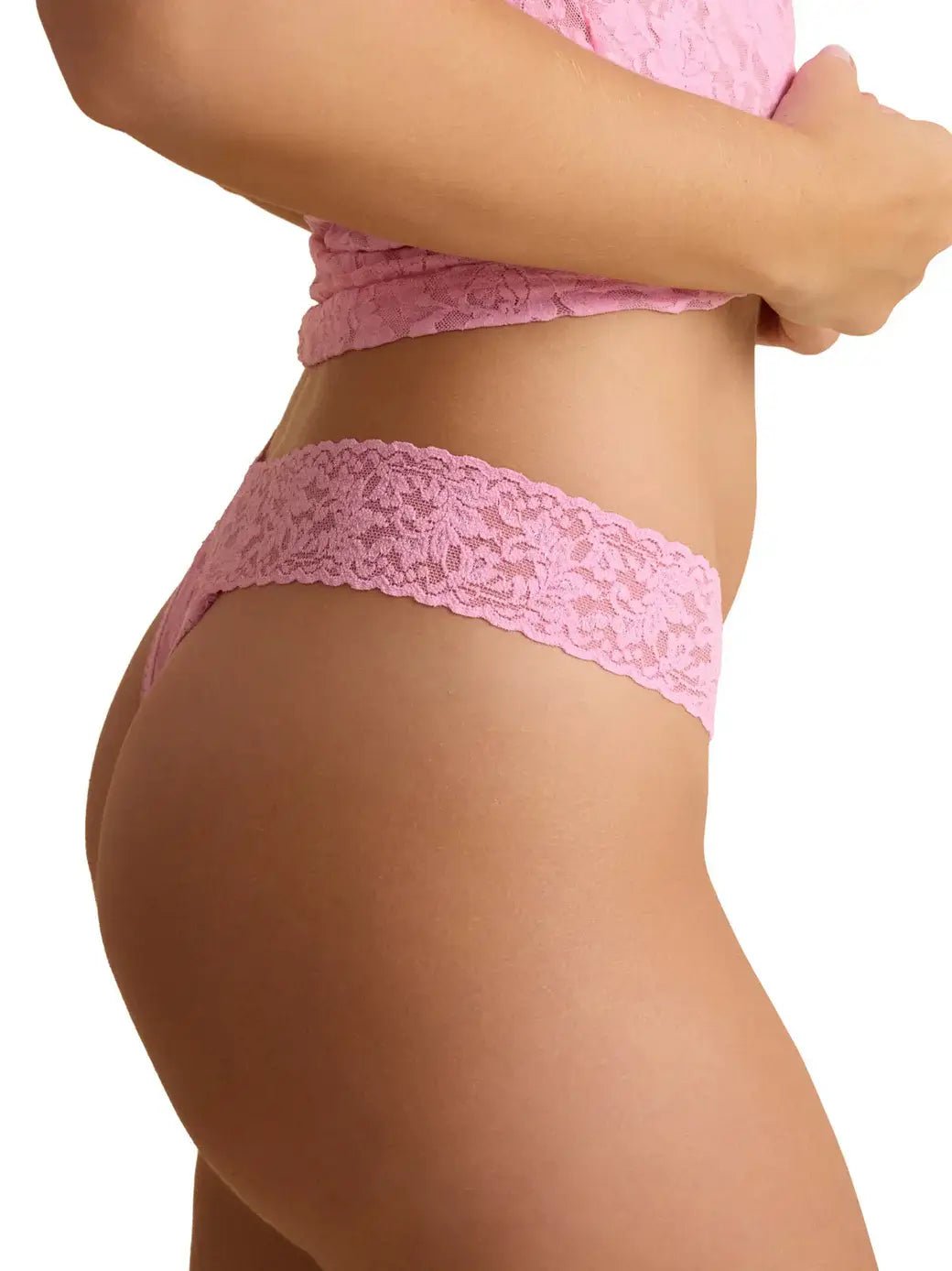 Hanky Panky Original Rise Thong in pink lace, showing side view and detail of the signature lace design