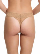 Hanky Panky Original Rise Thong - Signature Lace in tan color, showcasing the back view on a model.