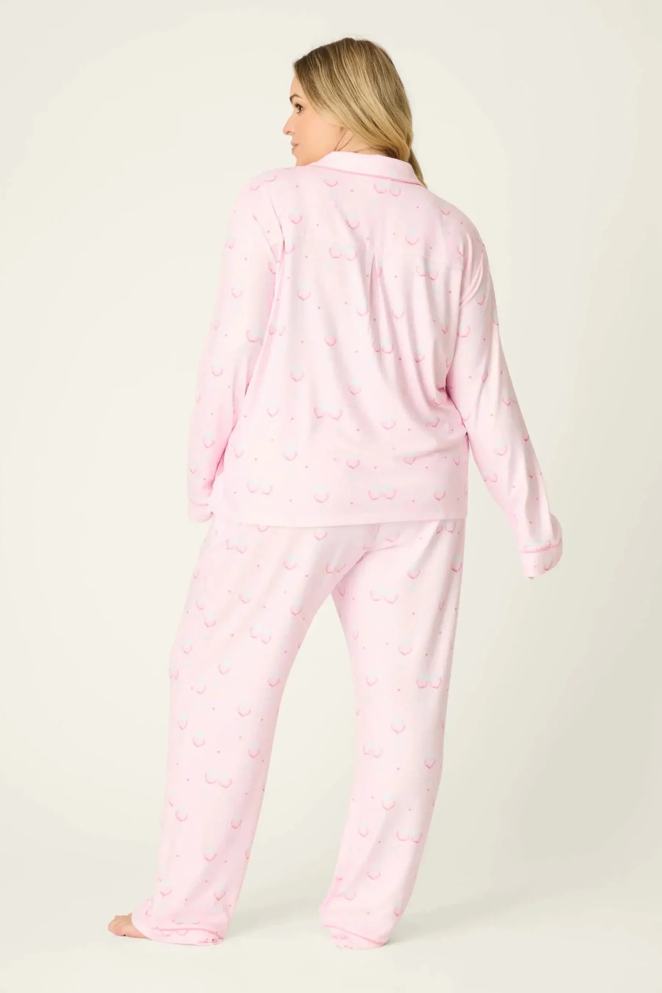 Happy Hour Wine Glass Print 3-Piece PJ Set Plus Size Inclusive model wearing playful pink pajama set with wine glass pattern, back view.