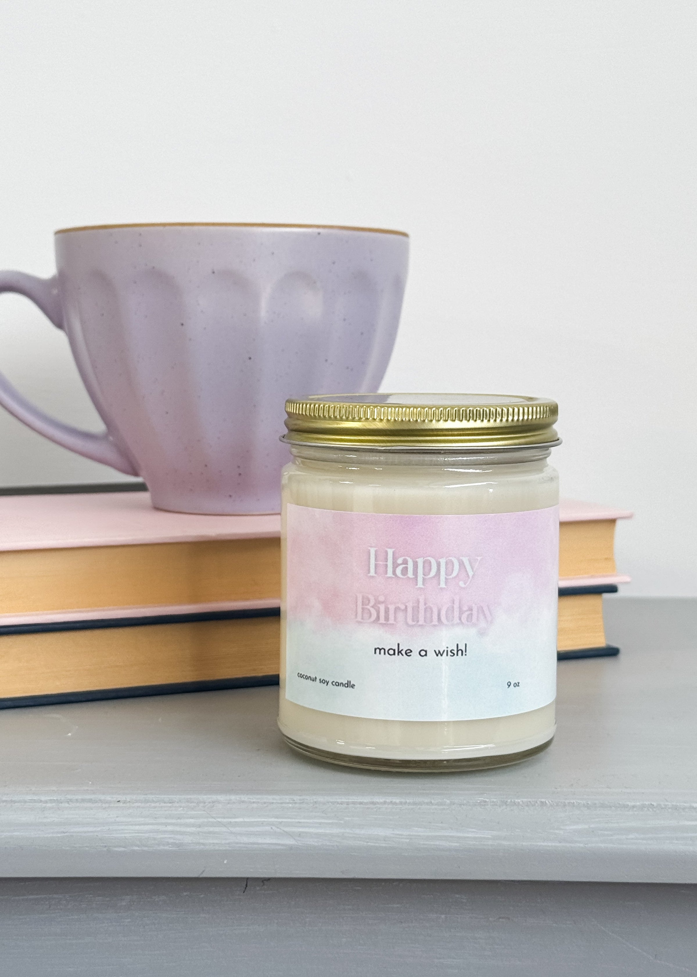 large coconut soy wax candle that says "happy birthday, make a wish!" - vanilla cake scented