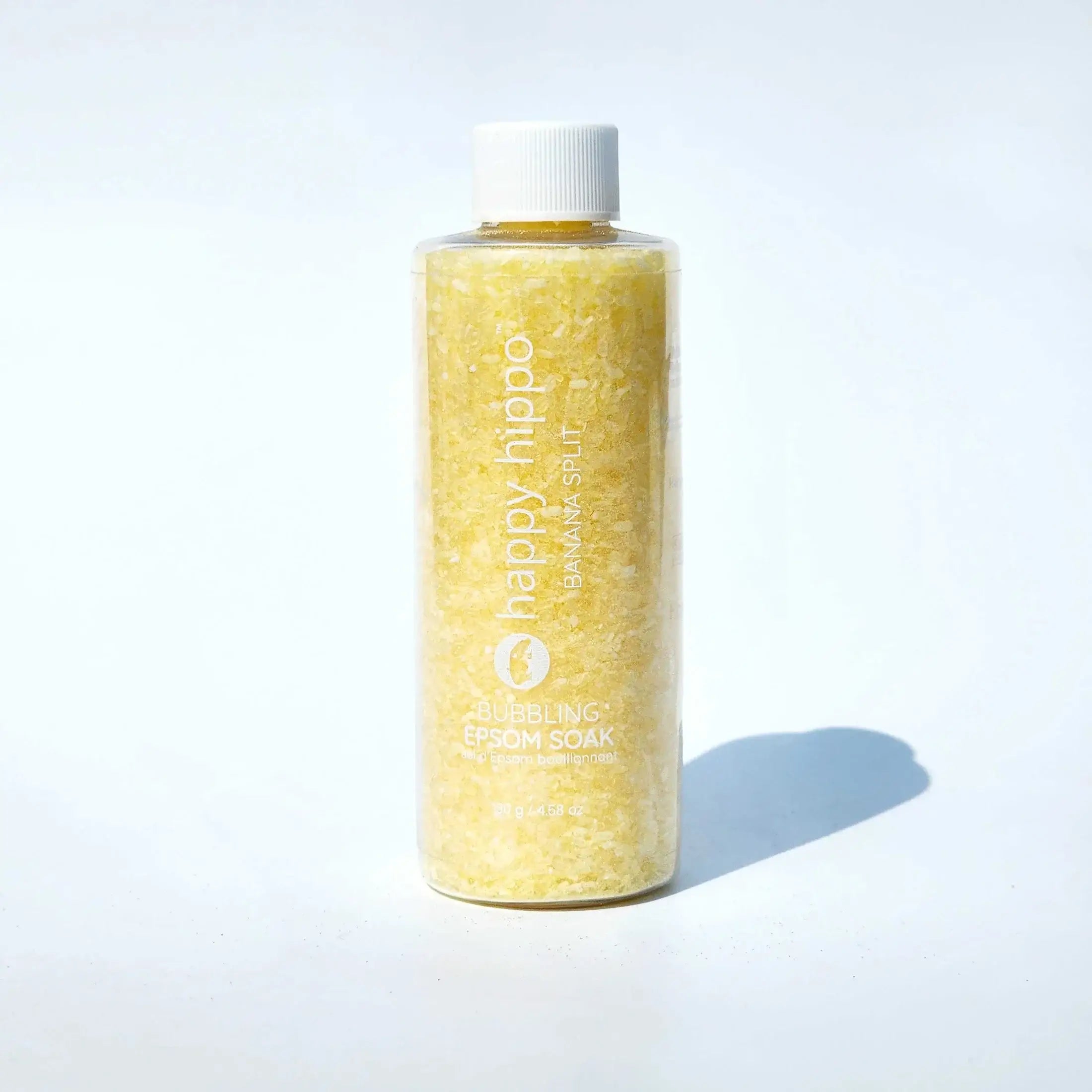 Bubbling Epsom Soak Happy Hippo Bath Co. bottle filled with natural Epsom salts for a relaxing bath experience.