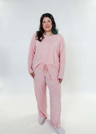 plus size woman standing wearing heather pink lounge set by miranda nic
