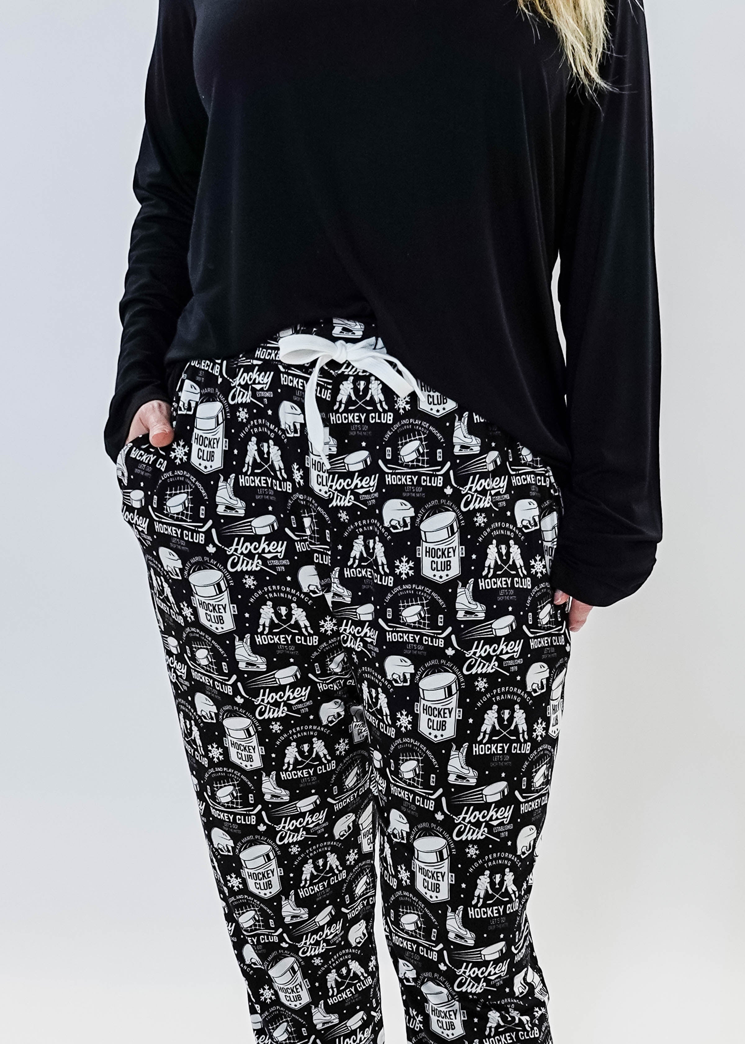 He Scores Hockey Print Unisex Bamboo Jogger featuring a hockey-themed design in black and white.