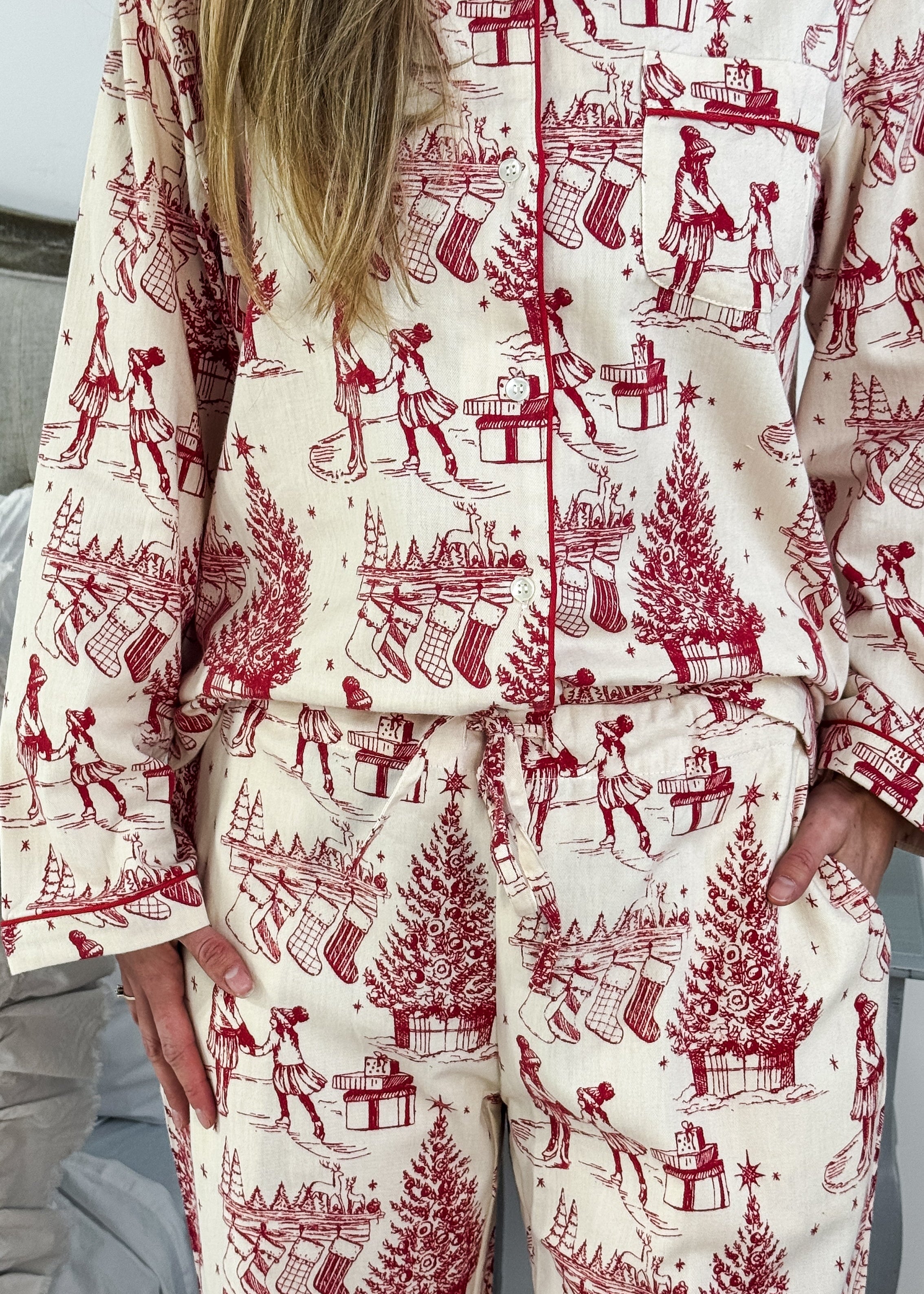 Woman wearing the Holiday Memories Flannel Button-Up PJ Set showcasing festive print with holiday designs.