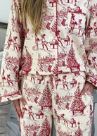 Woman wearing the Holiday Memories Flannel Button-Up PJ Set showcasing festive print with holiday designs.