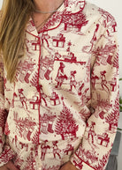Model wearing the Holiday Memories Flannel Button-Up PJ Set featuring festive holiday patterns.