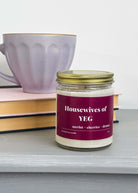 merlot and cherry scented coconut soy wax candle with "Housewives of YEG" label in red