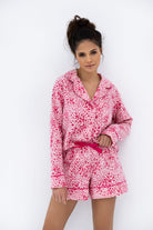 Model wearing the Sensis Kenzie Flannel Pajamas in the "Leopard Love" print, showing the button-down shirt and shorts.
