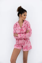 Kenzie Leopard Love Flannel Pajama Set in pink with leopard print, featuring shorts and a long-sleeve button-down shirt from Sensis.