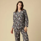 Kitty Cat Cotton Button Up Long Sleeve PJ Set featuring grey cats among flowers, modeled by a woman.