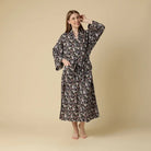 Kitty Cat Cotton Long Robe Mahogany on model, featuring playful grey cats among blooming flowers.