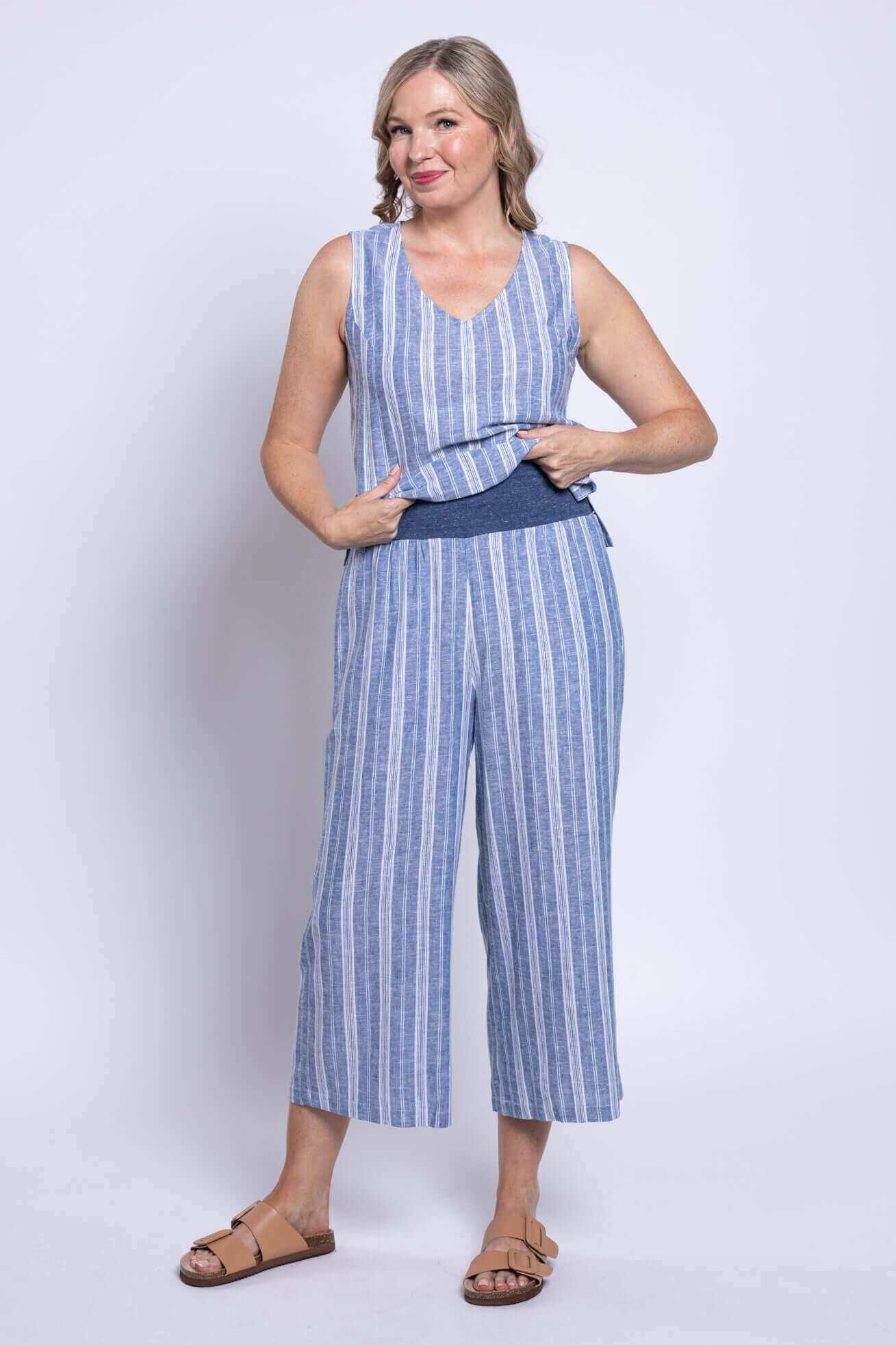 Model wearing Landon Capri striped linen-bamboo wide-leg cropped pant in blue, showcasing effortless coastal style.