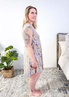 LATTE LOVE — Lace Sleep Dress in Linen Garden  worn on model in bedroom setting, showing side profile full length view 