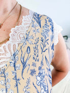 LATTE LOVE — Lace Sleep Dress in Linen Garden  worn on model in bedroom setting, showing close up of the lace and floral pattern