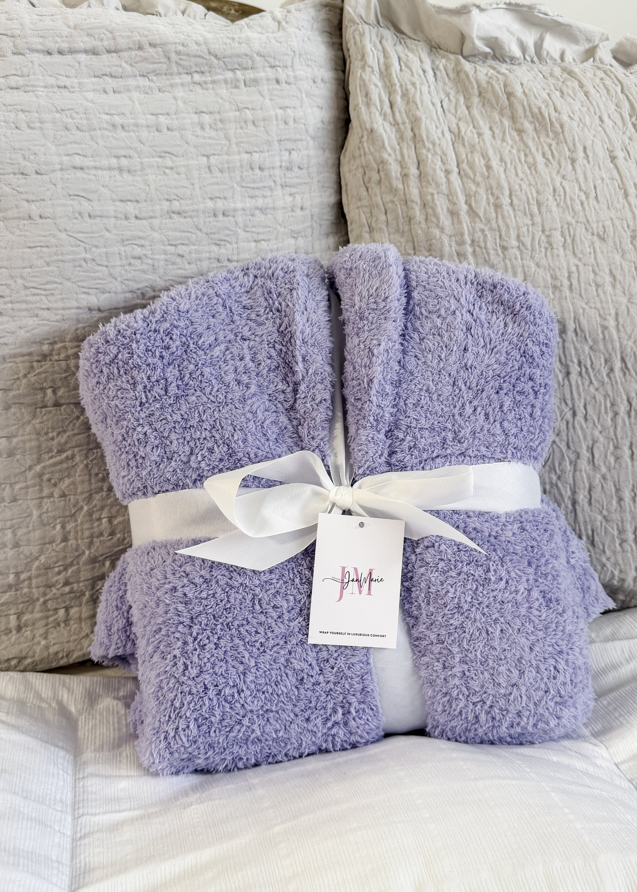 Lavender Chenille Cloud Spa Robe – Plush Stretch Robe with Pockets showing gift presentation, robe is wrapped with a white fabric ribbon and folded in a neat square. 
