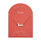 Zodiac Script Necklace in 14K Plated Gold featuring the Leo astrological sign on a stylish card.