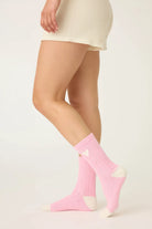 Pair of PJ Salvage Bright Pink Love you Latte Crew Socks with a white contrast toe and heel, showing the sweet heart graphic above the ankle.