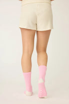 Pair of PJ Salvage Bright Pink Love you Latte Crew Socks with a white contrast toe and heel, showing the sweet heart graphic above the ankle.