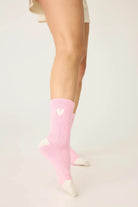 Pair of PJ Salvage Bright Pink Love you Latte Heart Crew Socks with a white contrast toe and heel, showing the sweet heart graphic above the ankle.
