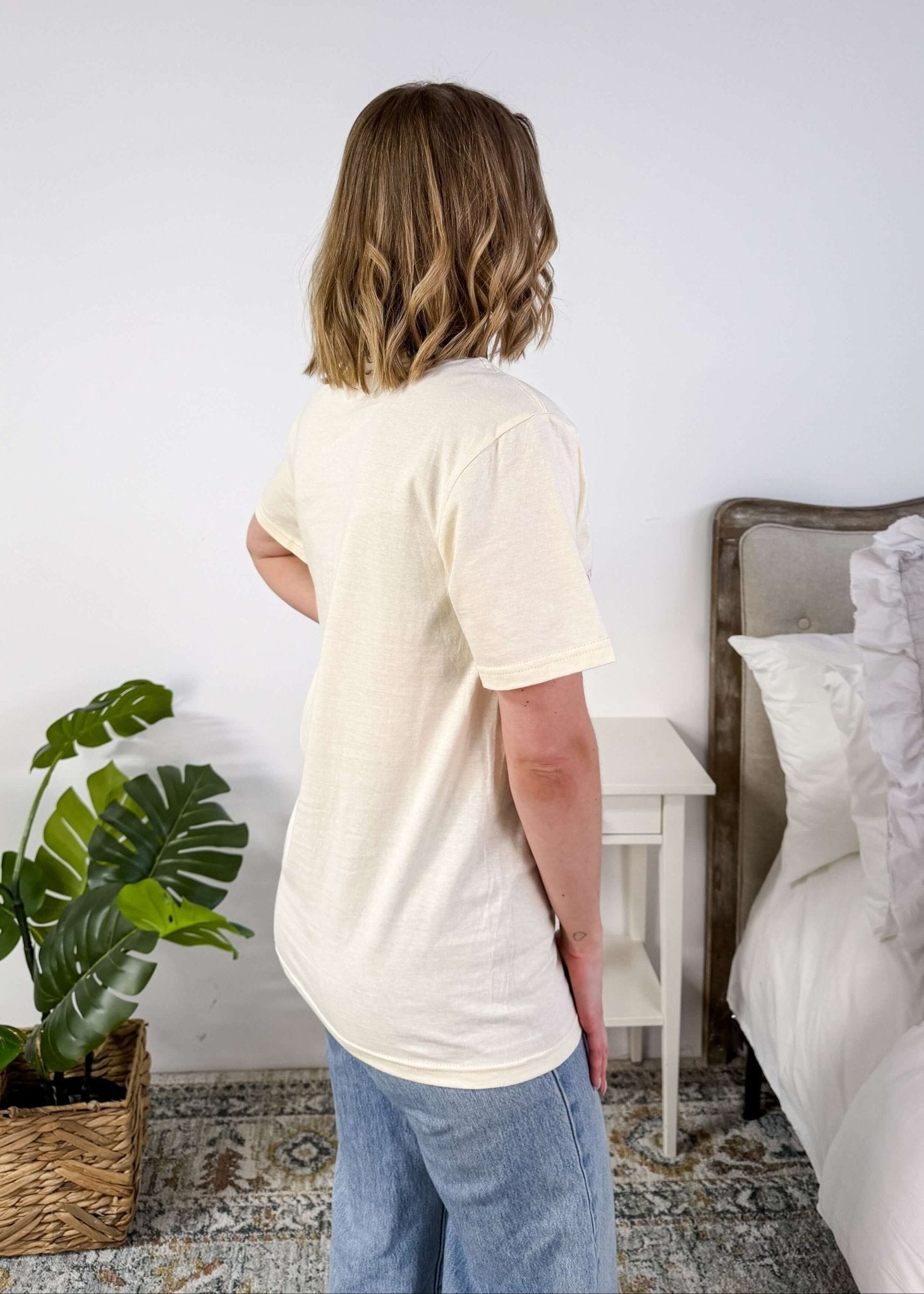 Cream Crew Fit Graphic Tee side profile on model