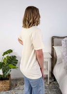 Cream Crew Fit Graphic Tee side profile on model