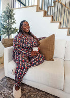 Merry Mugs Print Long Sleeve & Jogger Bamboo PJ Set by Georgia Rylan - plus size model on couch showing the cozy nature
