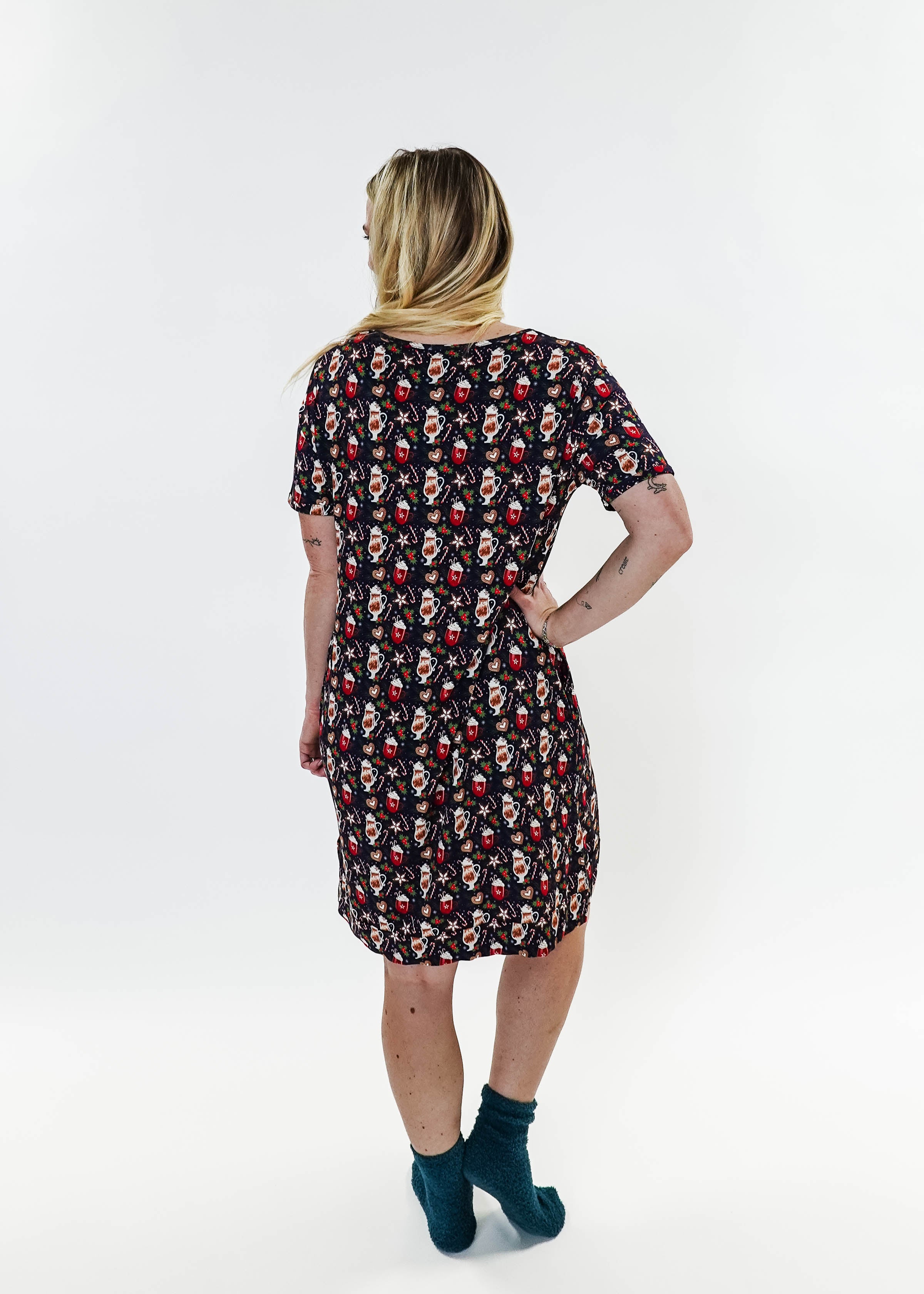 Merry Mugs V-Neck Bamboo Nightshirt featuring a whimsical holiday print, modeled by a woman standing with a cheerful expression.