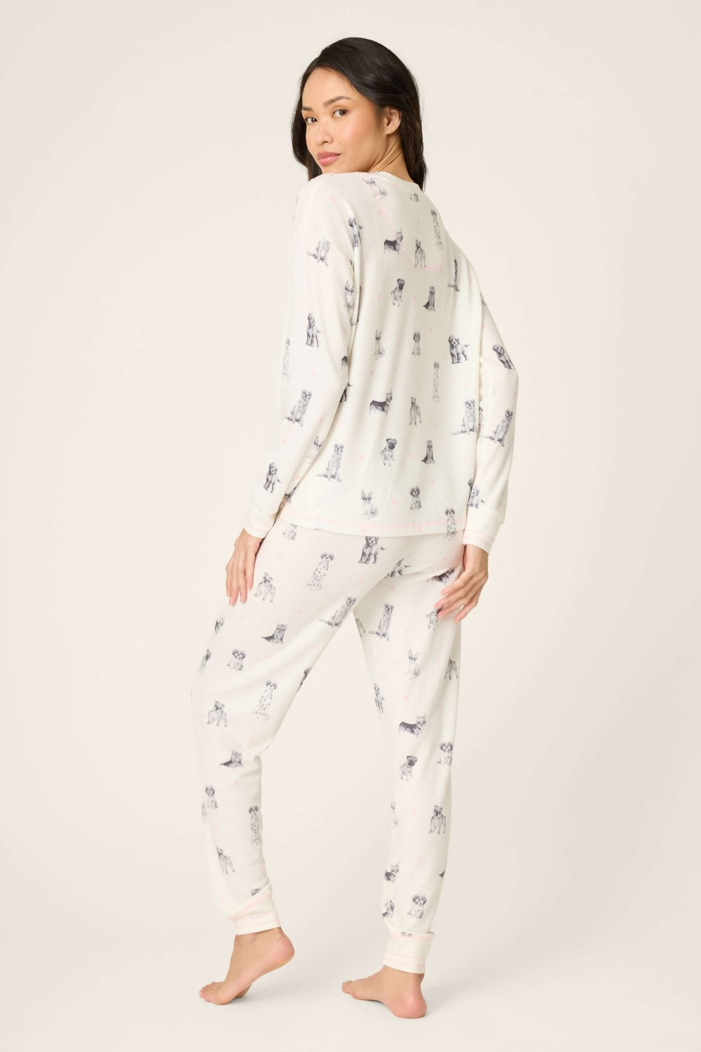 Woman wearing My Dog is my Valentine Peachy Jersey Jogger Set PJ Salvage, showcasing playful dog print and relaxed fit.