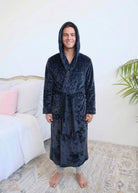 Long Navy Hooded Fleece Robe on male model in bedroom setting front view with hood up - Cloud Nine Pajamas