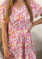 Close-up of the nightshirt fabric, showcasing the V-neck and the 7 seam pintuck detail below the chest.