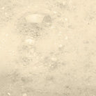 Oatmeal & Honey Bubbly Bath Salts dissolving to create fluffy bubbles in a warm bath.