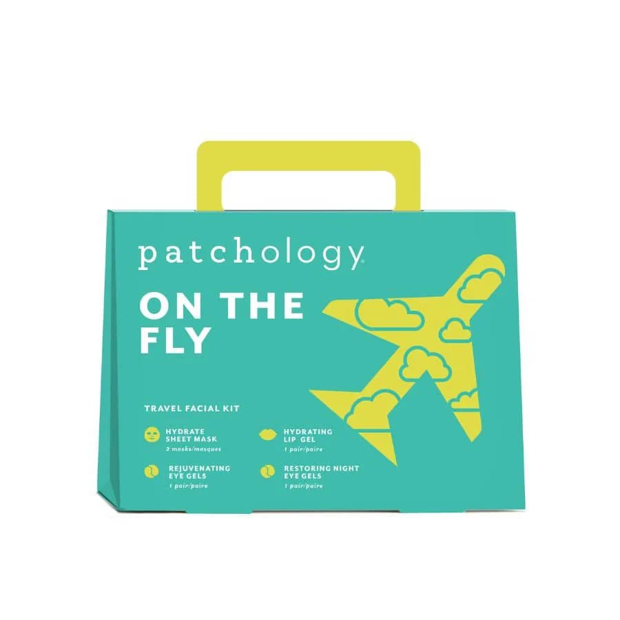 Product packaging for 'patchology on the Fly' with a teal background and yellow airplane graphic. Patchology On the Fly travel facial skincare kit carry on
