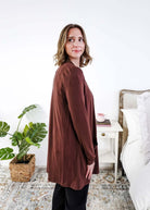 Woman wearing a brown long-sleeve cardigan in a bedroom setting Scarlett Ellie Summer Open Lightweight Cardigan | Cloud Nine Pajamas