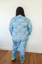 Back view of a person wearing the Paws On Ice Long Sleeve Jogger Velour Lounge Set by Miranda Nic, featuring whimsical winter patterns.