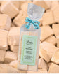 Handcrafted Gourmet Marshmallows in a clear bag with peach flavor and decorative ribbon, perfect for indulging.