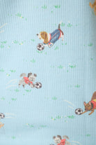 Print featuring playful dogs in sports jerseys with soccer balls on a light blue waffle-knit fabric.