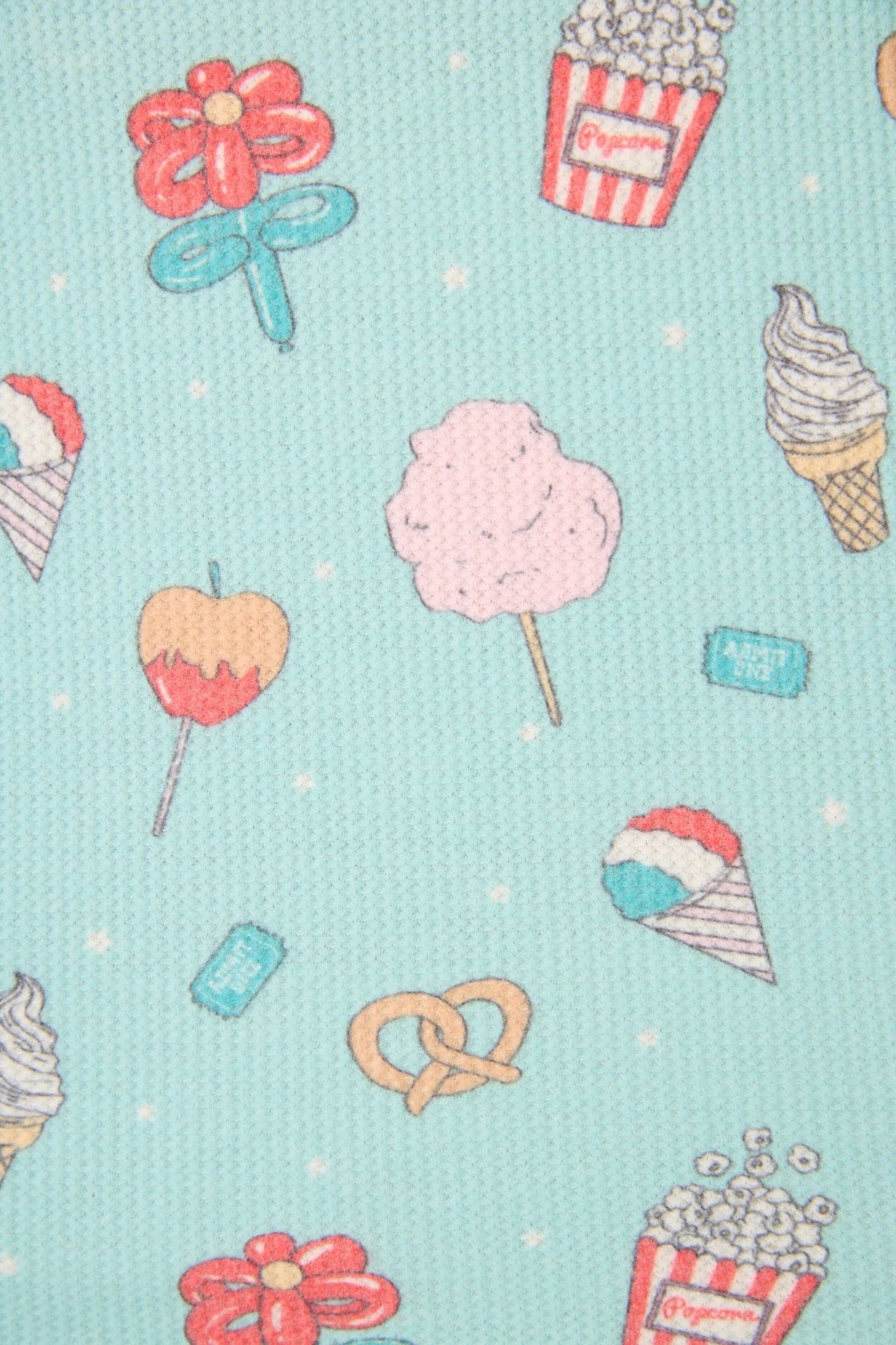 Colorful pattern of candy, ice cream, popcorn, and pretzel on a light blue background.