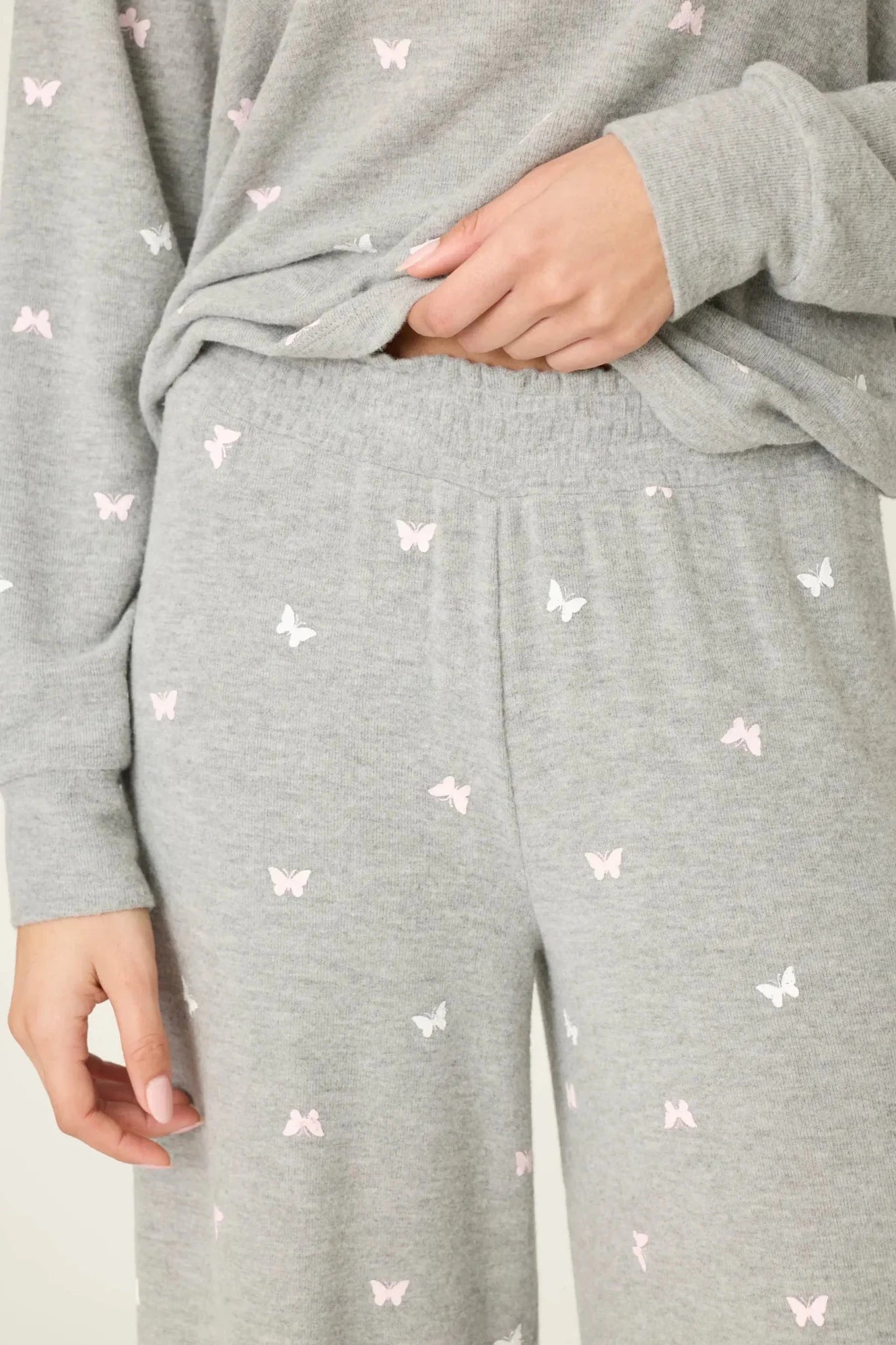 PJ Salvage Peachy Butterfly Kisses Lounge Set featuring soft grey fabric with pink butterfly prints and relaxed wide-leg pants.