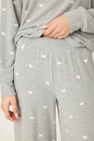 PJ Salvage Peachy Butterfly Kisses Lounge Set featuring soft grey fabric with pink butterfly prints and relaxed wide-leg pants.