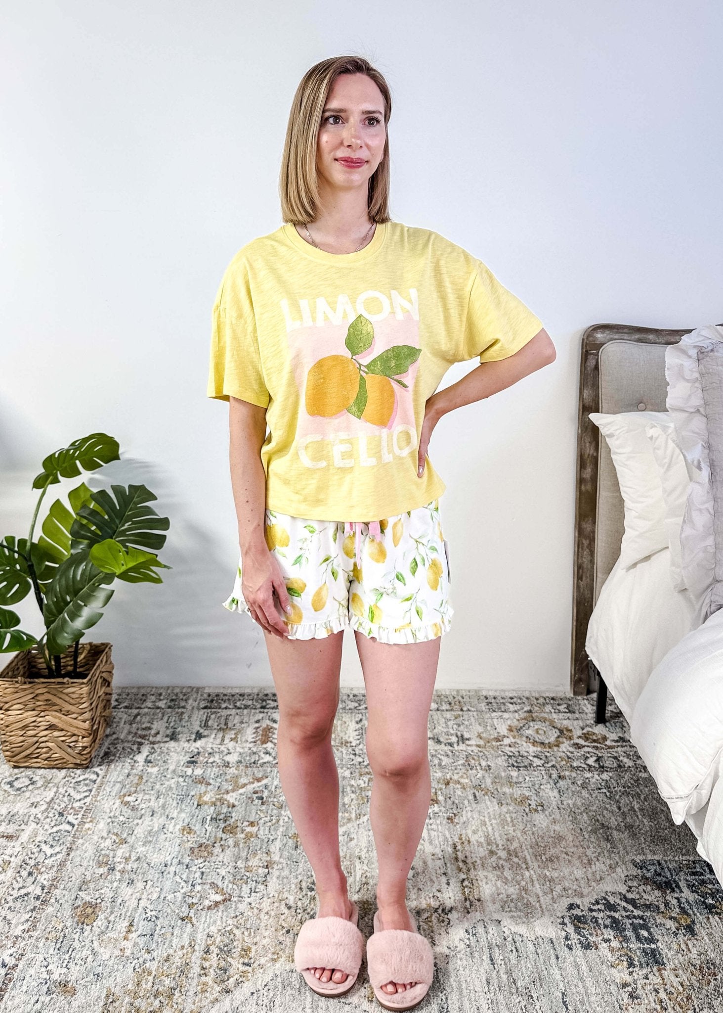 PJ SALVAGE — La Dolce Spritz Limoncello Graphic Tee & Lemon Zest Short Set shown on model in bedroom setting, full length shot