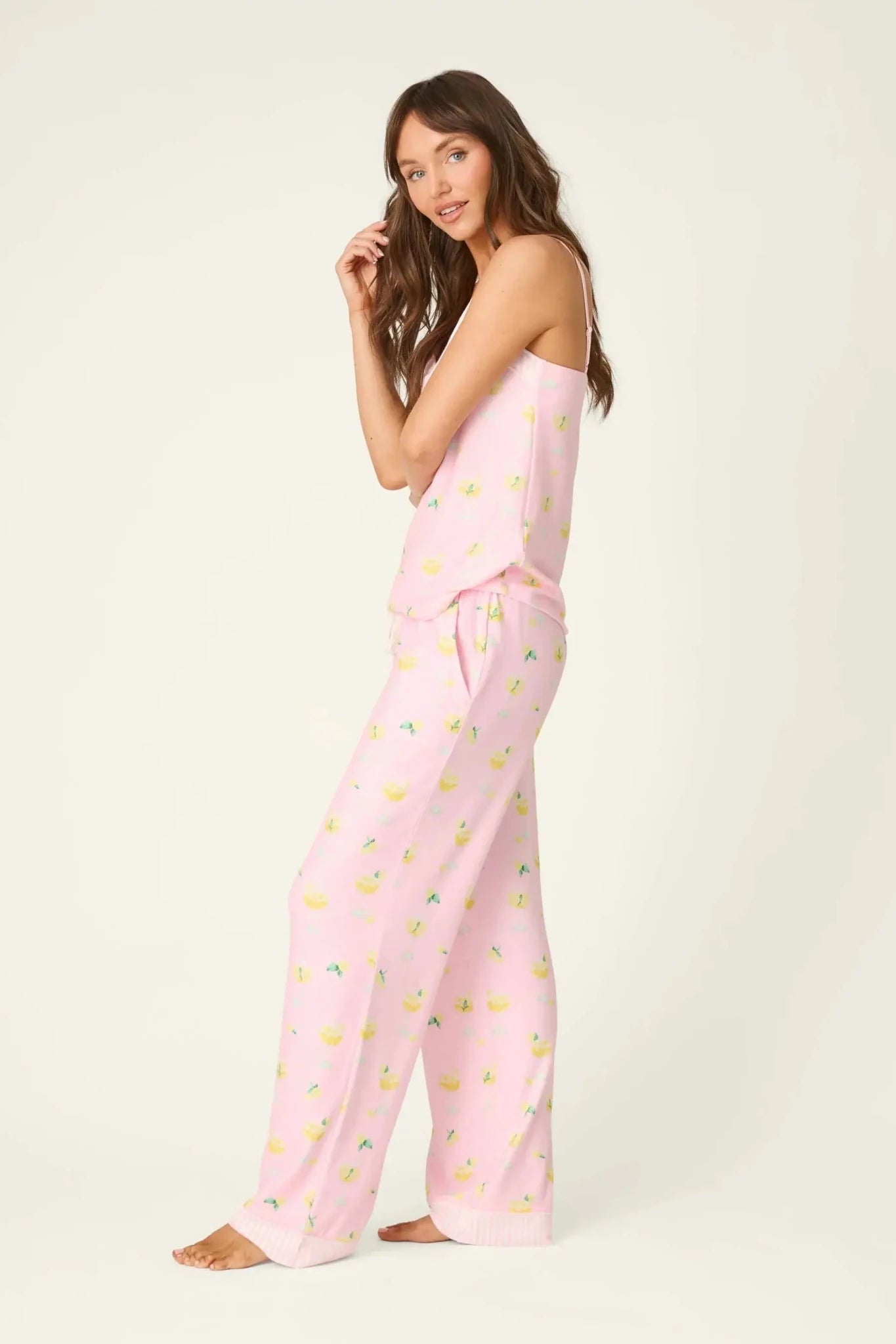 PJ Salvage - La Dolce Spritz Limoncello Life Long Butter Jersey PJ Set in pink with lemon print modeled side view.