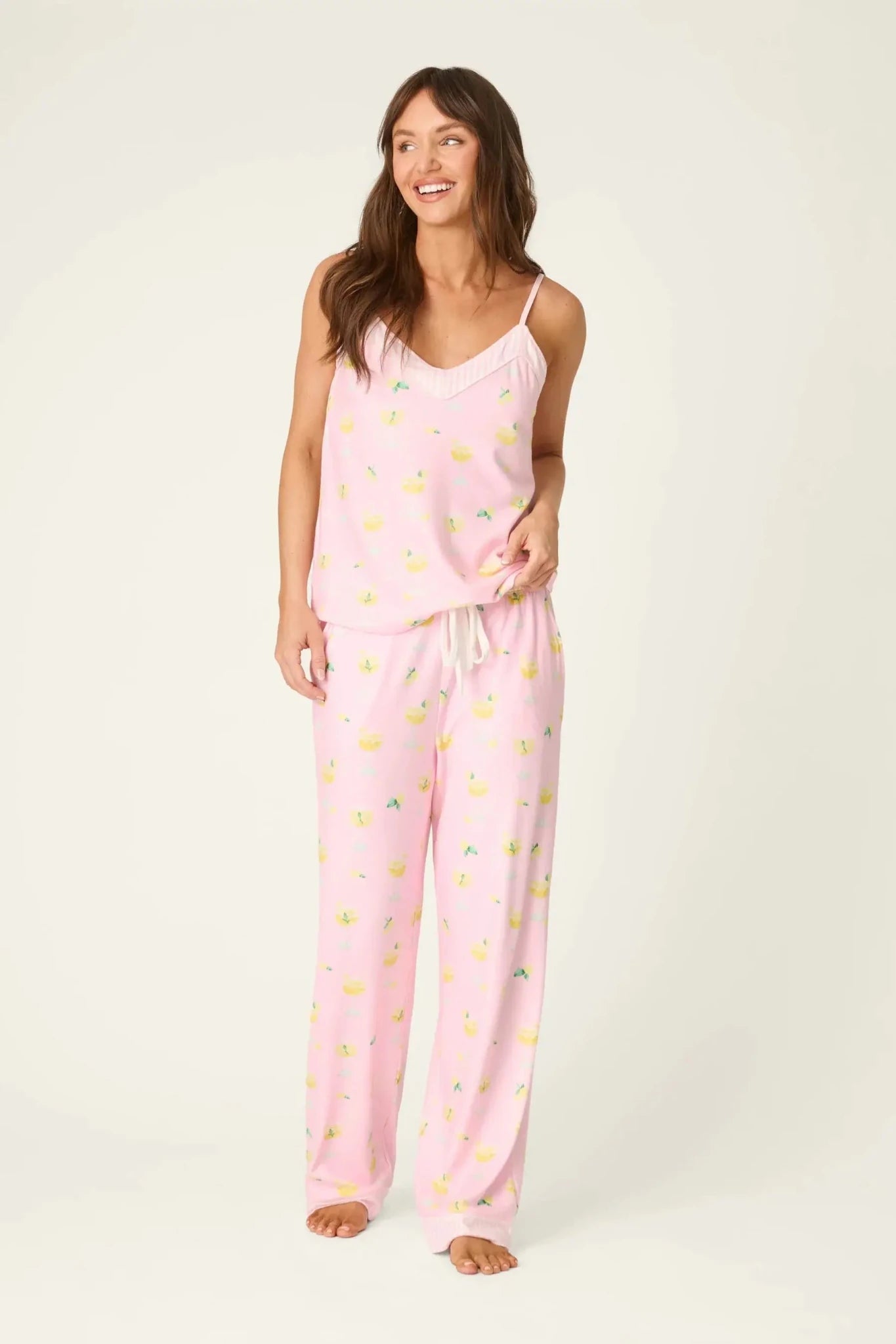PJ Salvage - La Dolce Spritz Limoncello Life Long Butter Jersey PJ Set model wearing pink pajama set with lemon print.