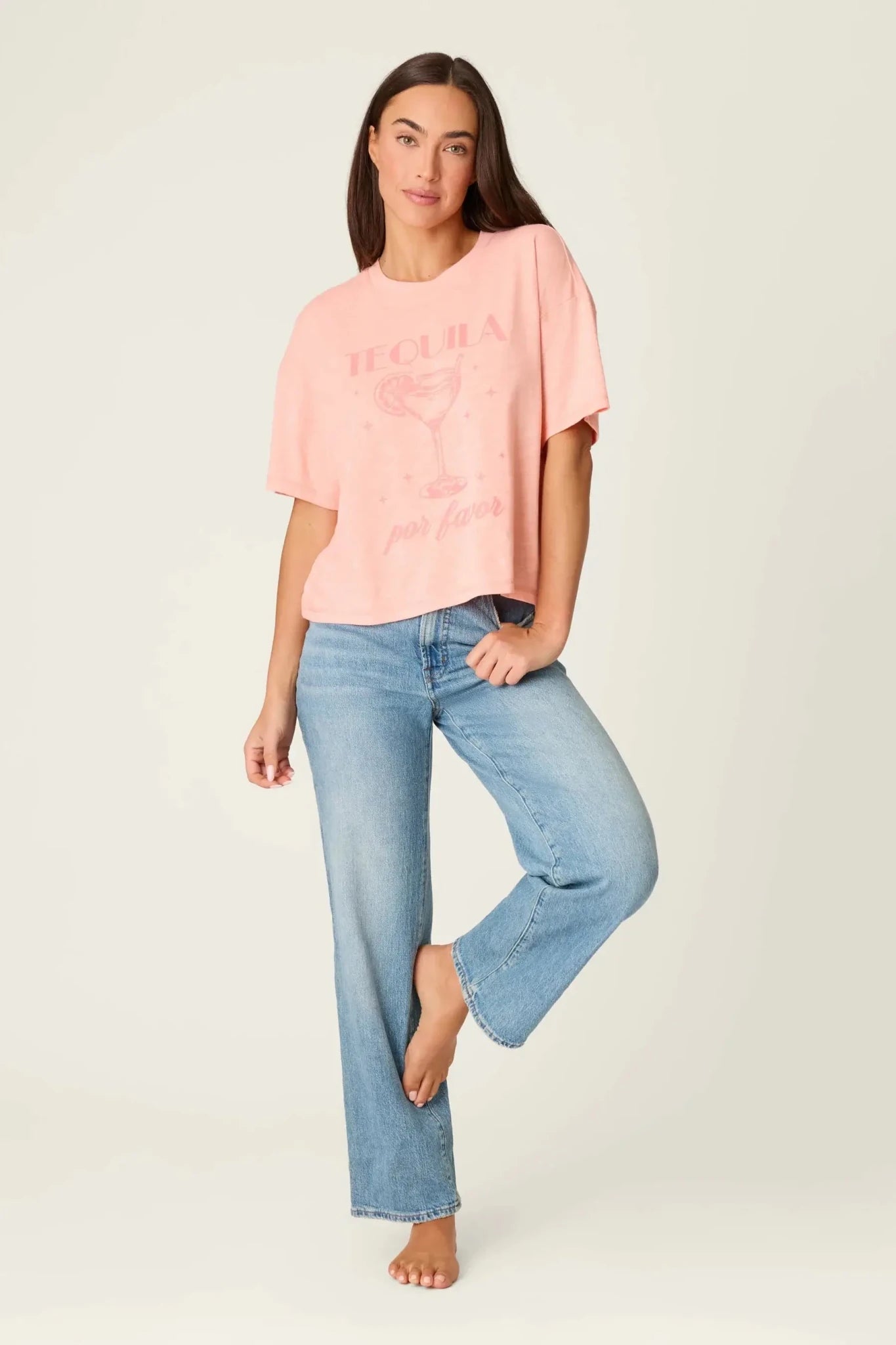  Model wearing PJ Salvage Paloma Mama "Tequila Por Favor" Graphic Tee in light pink with a cocktail graphic. full profile of model
