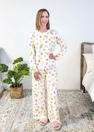 PJ SALVAGE — Viva la Vida Fruit Fiesta Long Sleeve & Pant Set worn on model in a bedroom setting, showing full length of the fruit print pj set
