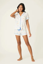 Model wearing PJ Salvage Whimsy Button Up & Short Short Set featuring playful prints on cotton-modal jersey.