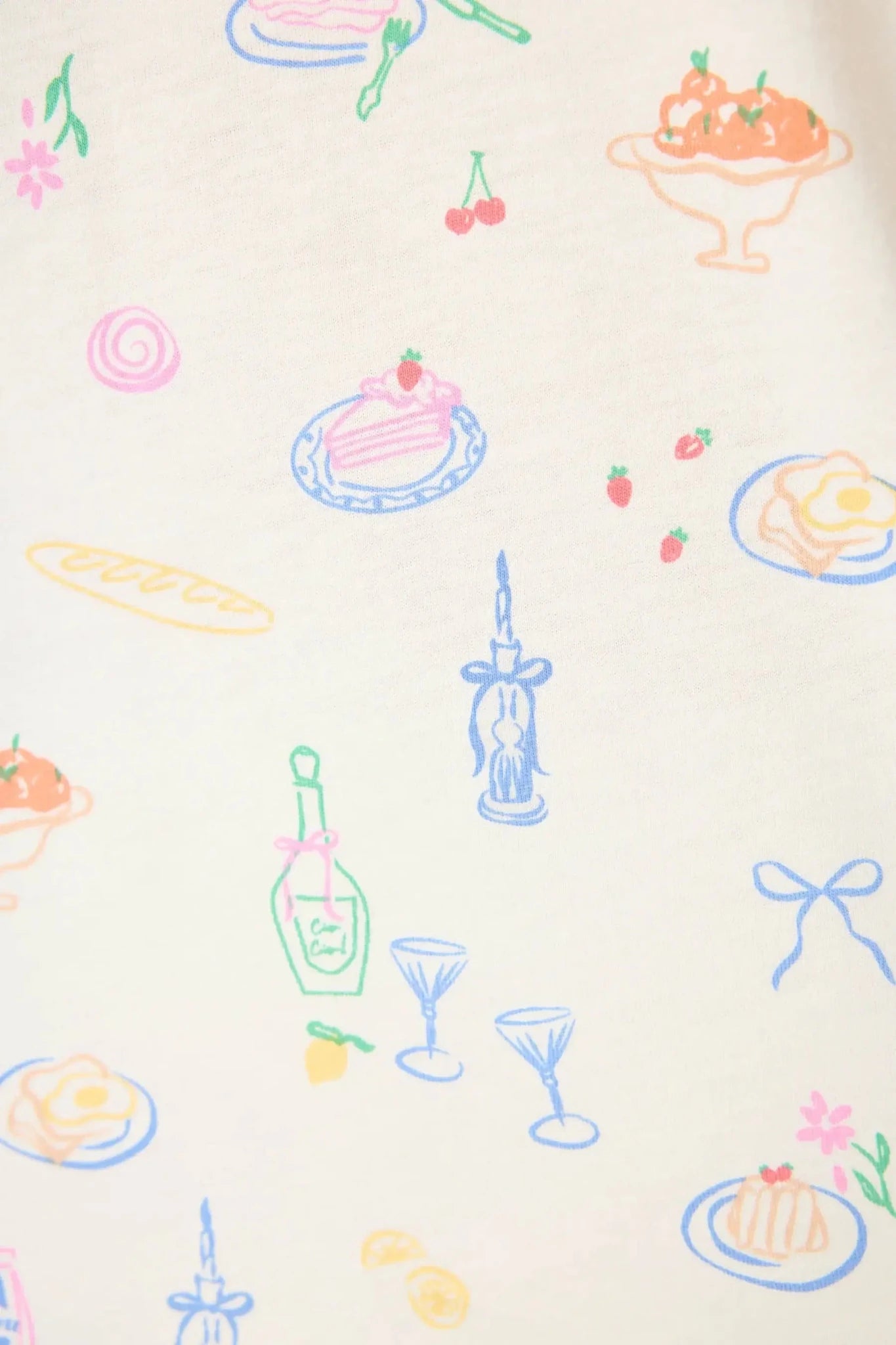 Colorful food and drink illustrations on the fabric of the PJ Salvage Whimsy Button Up & Short Short Set.