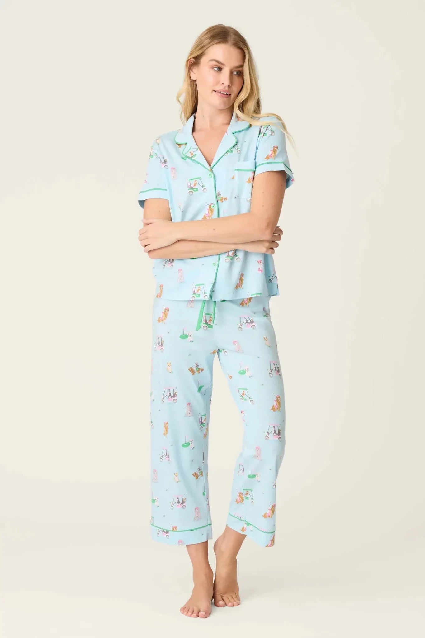 PJ SALVAGE Whimsy Cropped PJ Set in Light Blue Putter Pup print showing dogs golfing. Model stands wearing the set against a light background
