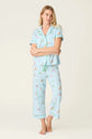 PJ SALVAGE Whimsy Cropped PJ Set in Light Blue Putter Pup print showing dogs golfing. Model stands wearing the set against a light background