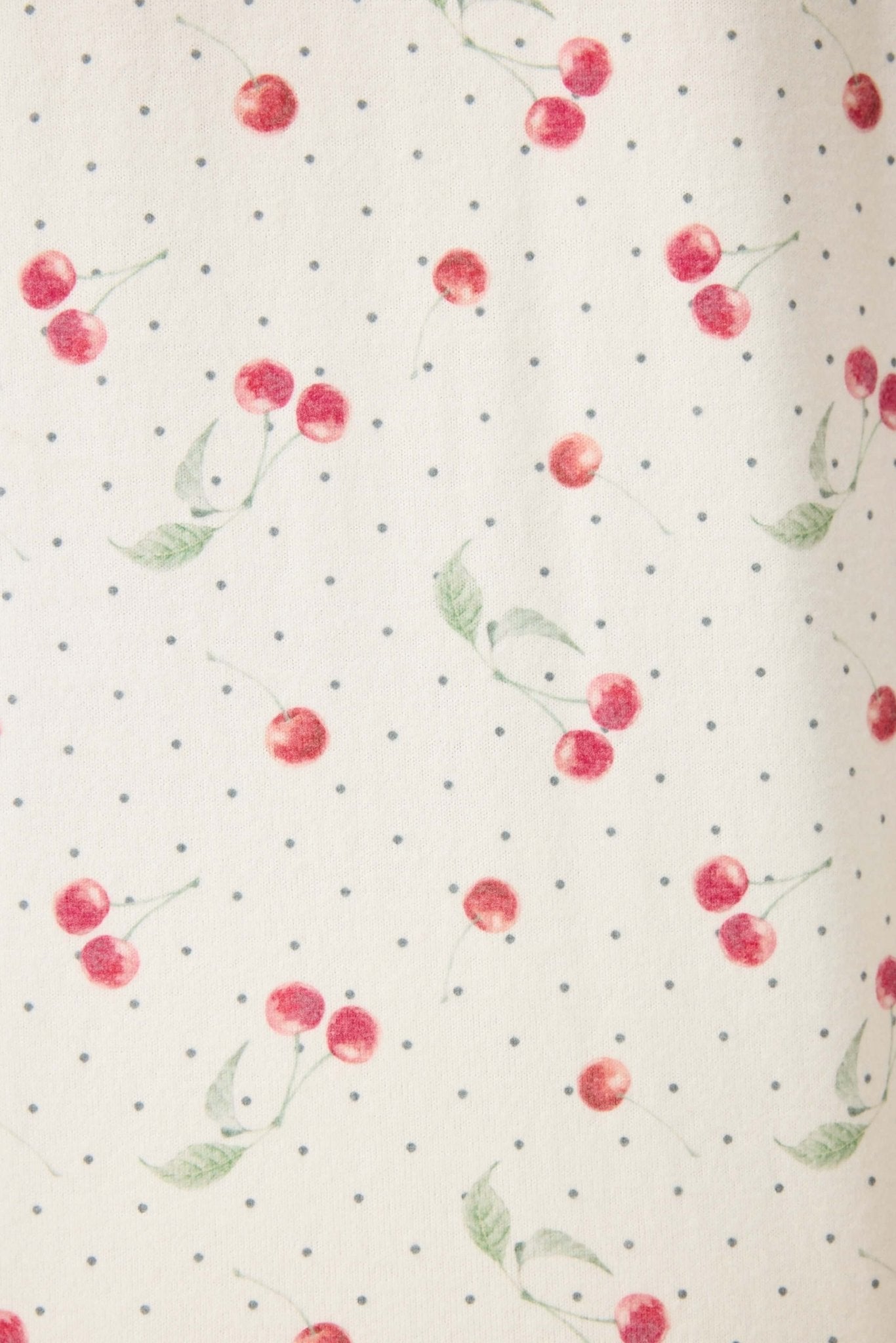 Polka Dot Cherries Peachy Jersey Pajama Set PJ Salvage fabric featuring red cherries on a polka dot background.